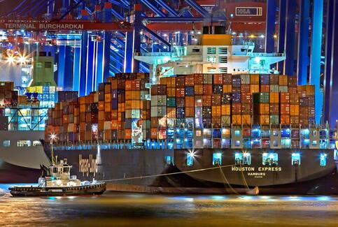 Cargo ship carrying containers of Indonesian coconut charcoal briquettes for export